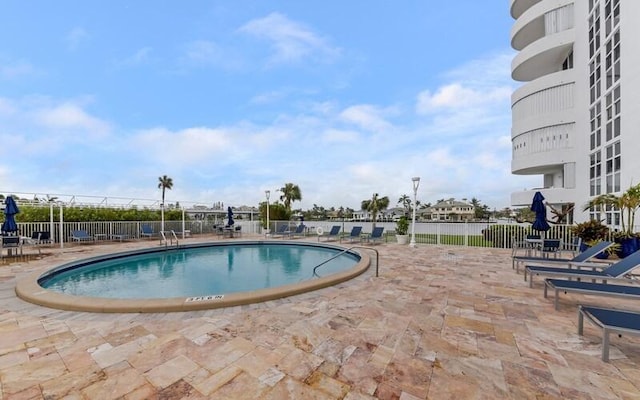 view of swimming pool featuring a patio