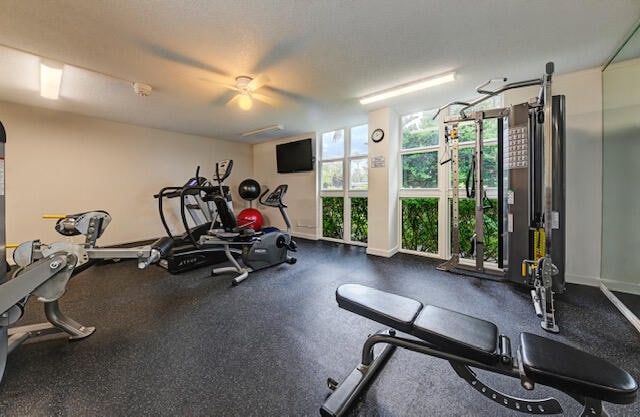 workout area with ceiling fan