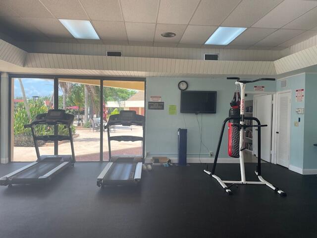 workout area with a paneled ceiling