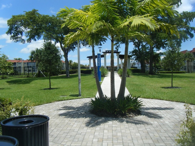 view of home's community with a yard