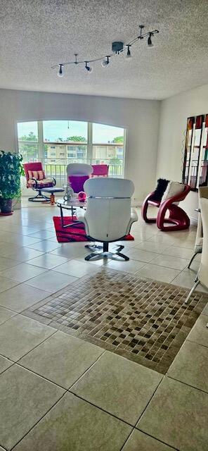 interior space featuring a wealth of natural light and tile patterned floors