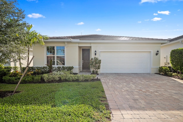 single story home with a front lawn and a garage