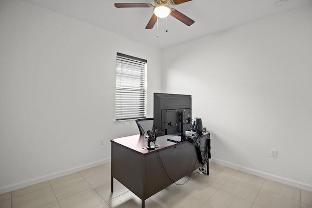 tiled home office featuring ceiling fan