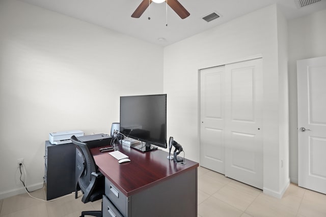 home office with ceiling fan and light tile patterned floors