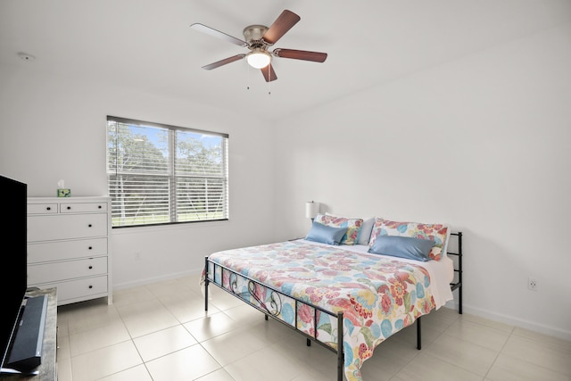 bedroom with light tile patterned flooring and ceiling fan