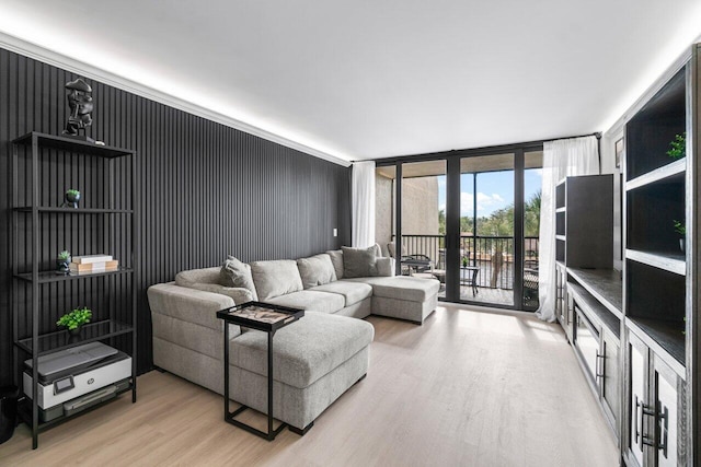 living room featuring a wall of windows and hardwood / wood-style floors