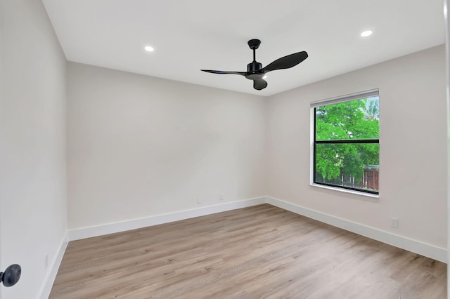 unfurnished room with light wood-type flooring and ceiling fan