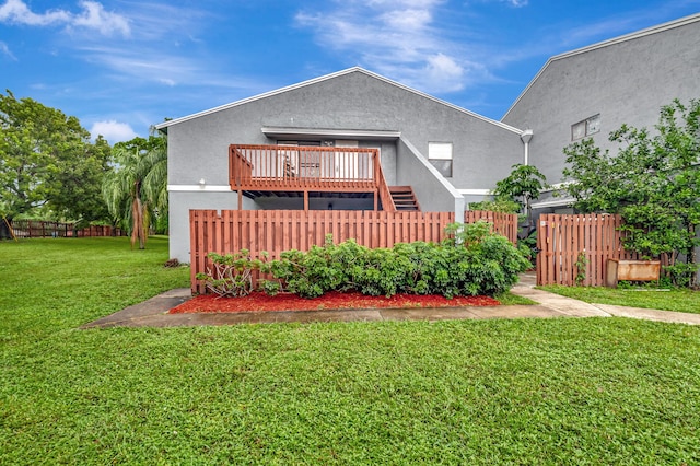 rear view of house with a yard