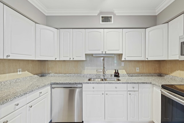 kitchen with white cabinets, sink, light stone countertops, and stainless steel appliances