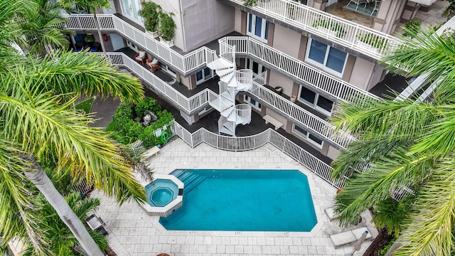 view of pool with an in ground hot tub