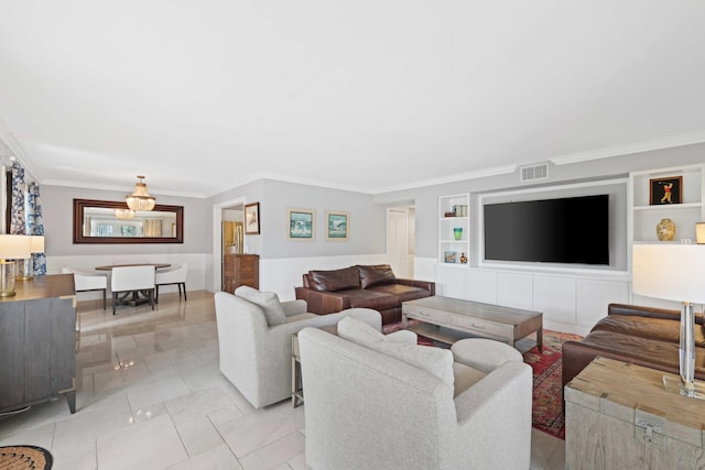 living room featuring built in shelves, ornamental molding, and light tile patterned flooring