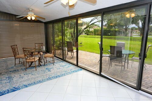 sunroom / solarium with ceiling fan