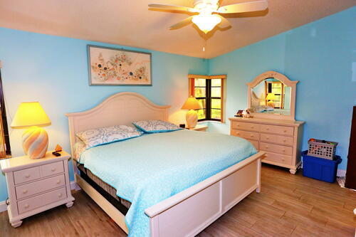 bedroom featuring ceiling fan and hardwood / wood-style flooring