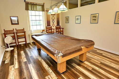 game room with dark hardwood / wood-style floors and pool table