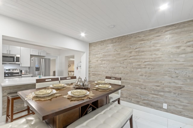 dining room featuring wooden ceiling