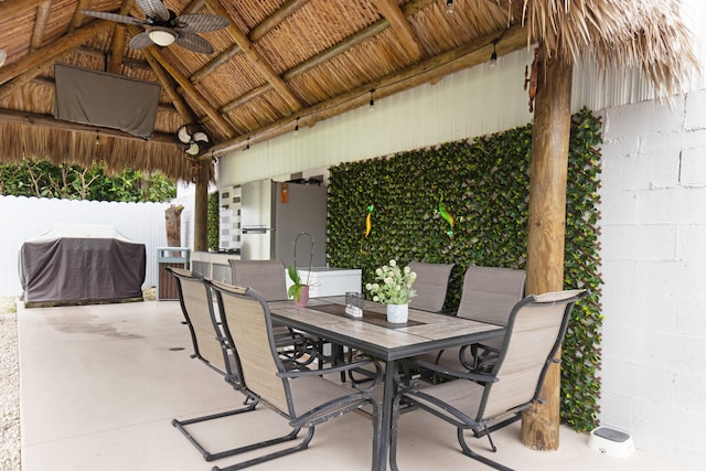 view of patio / terrace featuring area for grilling, ceiling fan, and a gazebo