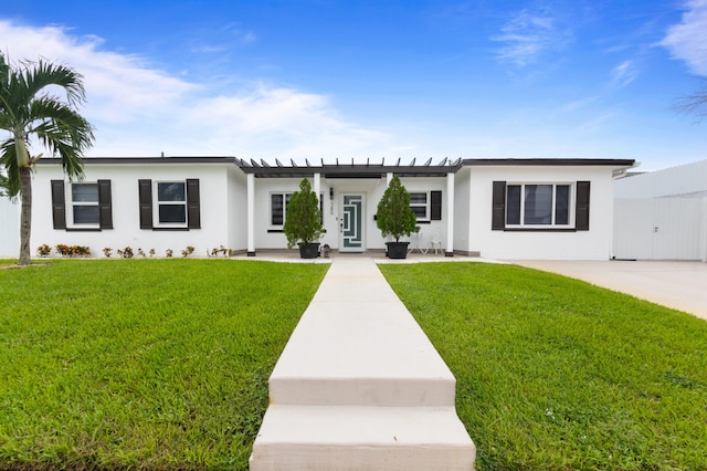 ranch-style home with a front lawn