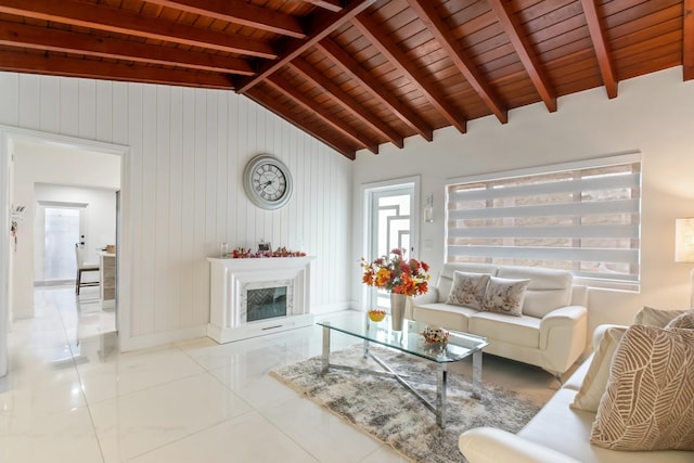 living room featuring vaulted ceiling with beams, wood walls, light tile patterned floors, and wooden ceiling