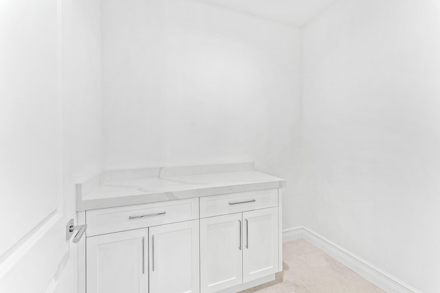 bathroom with vanity and tile patterned flooring