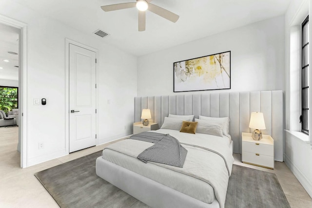 tiled bedroom with ceiling fan