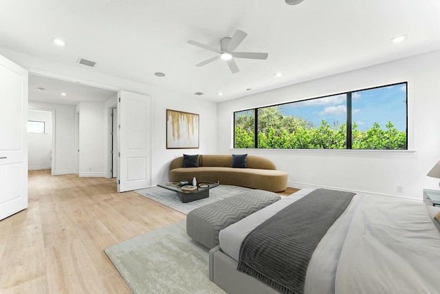 bedroom featuring ceiling fan and light hardwood / wood-style floors