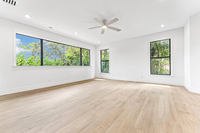 unfurnished room featuring ceiling fan and light hardwood / wood-style floors