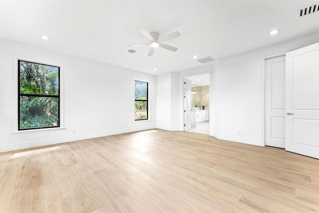 unfurnished room featuring ceiling fan and light hardwood / wood-style flooring