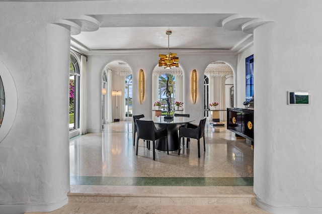 dining room with an inviting chandelier and ornamental molding