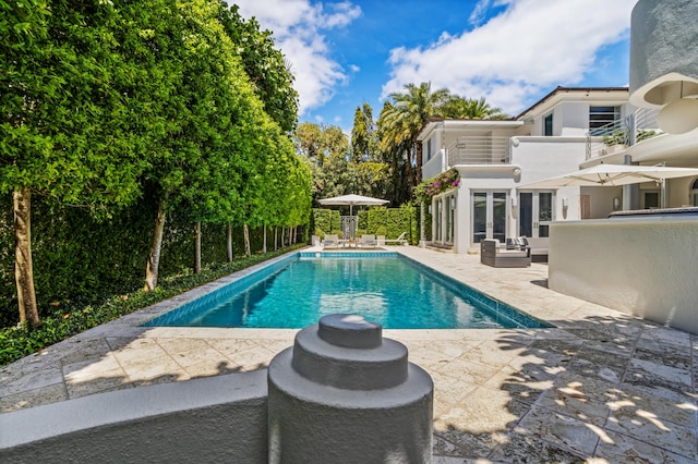 view of swimming pool with a patio area