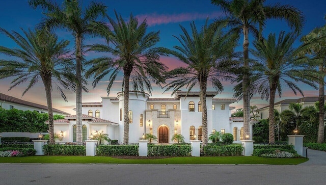 view of outdoor building at dusk