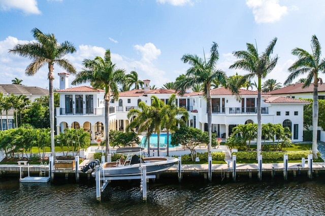 exterior space featuring a water view and a balcony