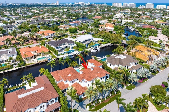 birds eye view of property with a water view