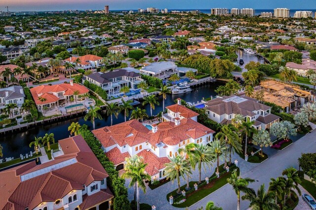 aerial view at dusk with a water view