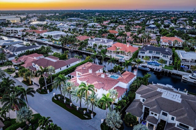 aerial view at dusk with a water view