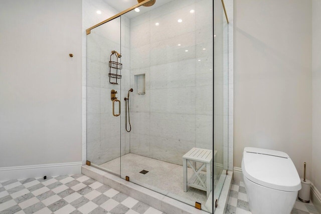 bathroom with an enclosed shower and toilet