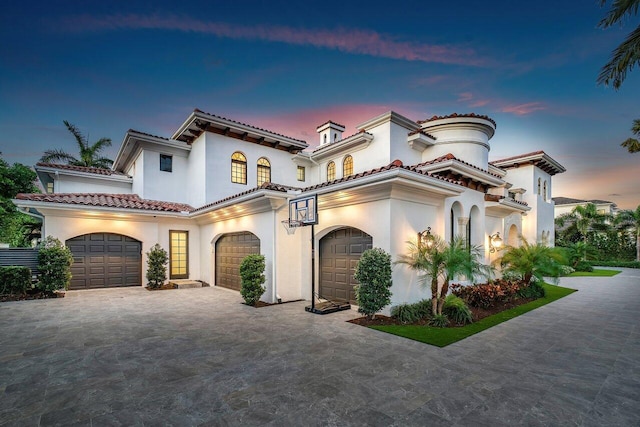 mediterranean / spanish-style home featuring a garage