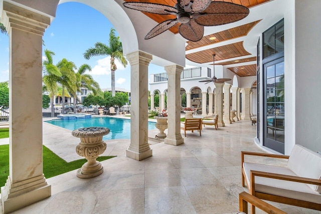 view of pool featuring a patio and ceiling fan