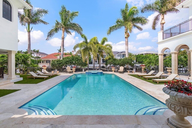 view of swimming pool with an in ground hot tub and a patio