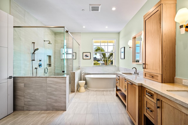 bathroom with independent shower and bath, vanity, tile walls, and tile patterned floors