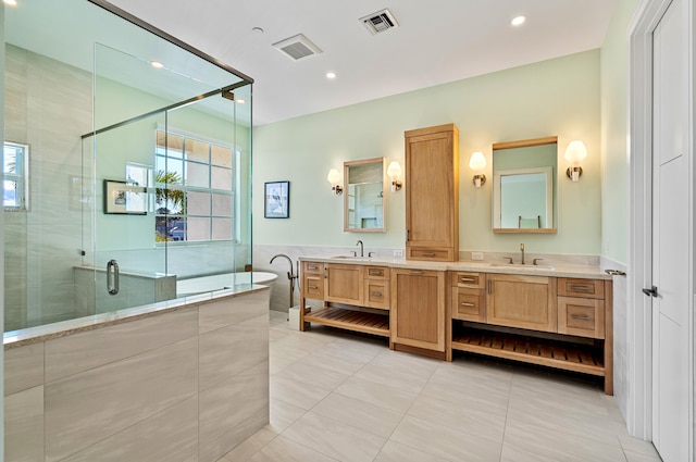 bathroom with independent shower and bath, tile patterned flooring, vanity, and tile walls