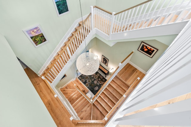 1583 Estuary Trl, Delray Beach, FL 33483 - stairs with baseboards, wood finished floors, and a towering ceiling