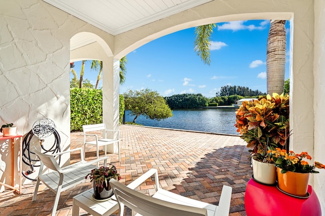 view of patio featuring a water view