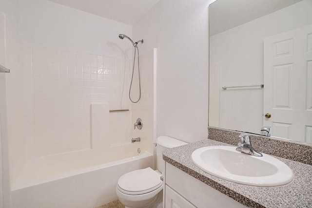 full bathroom with  shower combination, vanity, and toilet