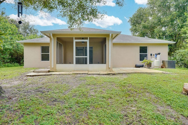 back of property featuring a yard, central AC unit, a sunroom, and ceiling fan