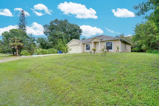 ranch-style home featuring a front yard and a garage