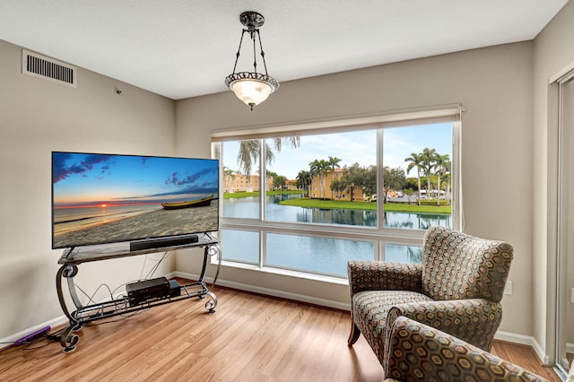 5777 Gemstone Ct Unit 304, Boynton Beach, FL 33437 - sitting room with wood finished floors and baseboards