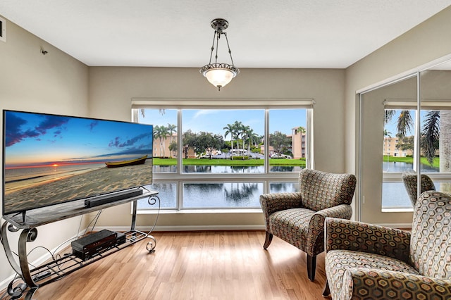 5777 Gemstone Ct Unit 304, Boynton Beach, FL 33437 - living area featuring wood finished floors and baseboards