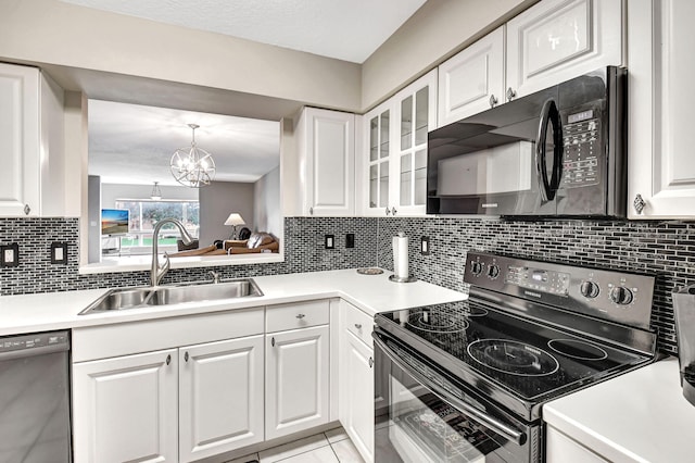5777 Gemstone Ct Unit 304, Boynton Beach, FL 33437 - kitchen featuring range with electric stovetop, black microwave, dishwasher, and white cabinetry