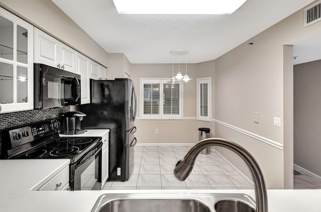 5777 Gemstone Ct Unit 304, Boynton Beach, FL 33437 - kitchen with black appliances, light marble finish flooring, white cabinets, and glass insert cabinets