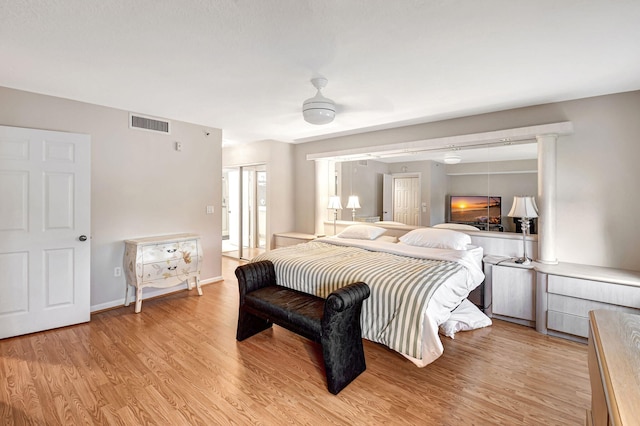 bedroom with ceiling fan and light hardwood / wood-style flooring